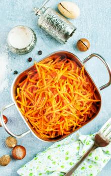 carrot salad in metal bowl on a table