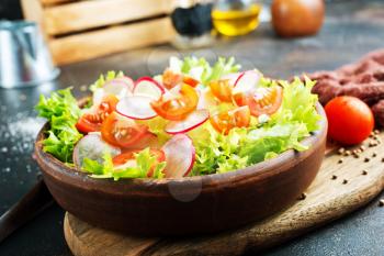 fresh vegetable salad on plate on a table