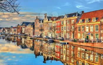 Traditional houses beside a canal in Leiden - South Holland, the Netherlands