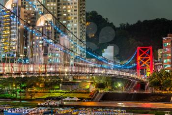 Bitan Suspension Bridge across the Xindian River at night. New Taipei City, Taiwan