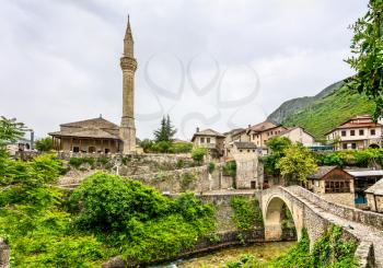 View of Nezir Agina Mosque and Crooked bridge in Mostar, Bosnia and Herzegovina