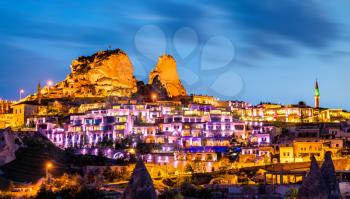 View of Uchisar with the castle at sunset. Cappadocia, Turkey
