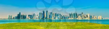 Panorama of Doha with green grass. The capital of Qatar.