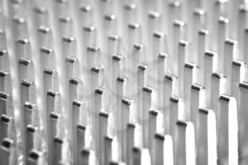 Abstract background of metal columns with a small focus close up
