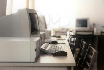 Image of a room with old computers stylized as an old photo with soft focus