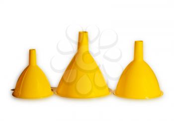 Three yellow plastic funnels isolated on white background