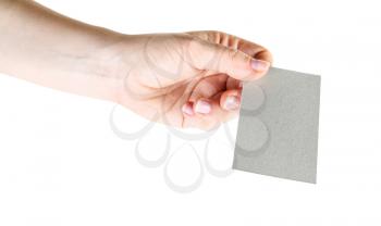Photo of blank business card in hand isolated with clipping path on white background. Mock-up for design presentations and portfolios.