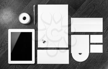 Blank stationery set. Corporate identity template on wooden background. For design presentations and portfolios. Black and white image.