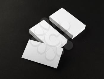 Blank business cards on black background. Template for branding identity. Clipping path.
