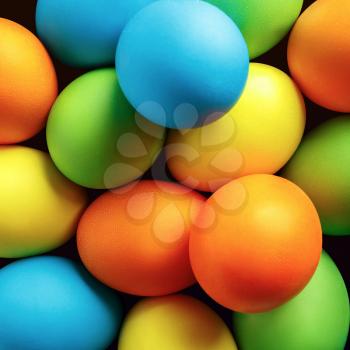Close-up of brightly colored Easter eggs. Easter background. Top view.