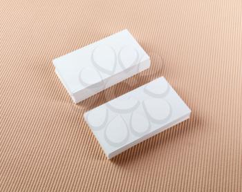 Two stacks of blank business cards on a colored background. Template for ID.