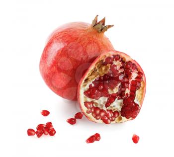 Juicy pomegranate and its half. Isolated on white background.