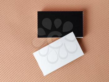 Black and white business cards on color background. Mock-up for branding identity. Isolated with clipping path. Top view.