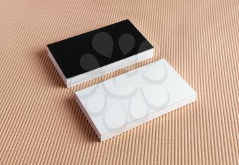 Set of black and white business cards on a color background.