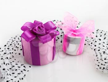 Two colorful gift boxes with ribbons and bows.
