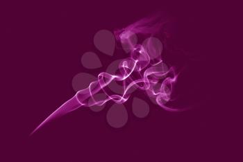 Pink smoke of joss stickSmoke abstract background.