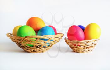Easter eggs in baskets. Bright colored easter eggs.