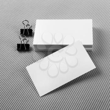 Stack of blank business cards on a light gray background. Template for branding identity.