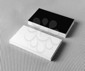 Several black and white business cards on gray background. Mockup for branding identity.