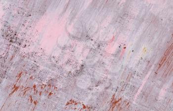 Old weathered grunge metal background with rust stains, painted pink paint.