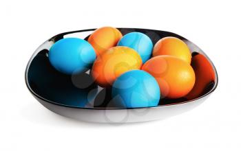 Black dish with dyed Easter eggs. Colorful easter eggs. Isolated on white background with clipping path.