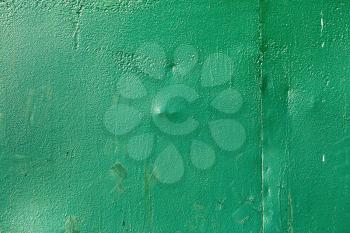 Green background. Bright painted old textured wall.