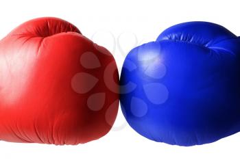 Blue and red boxing gloves close up. Isolated on white background.