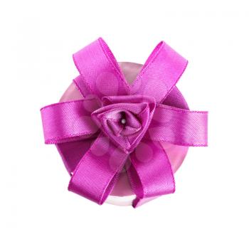 Purple ribbon in the shape of flowers on a festive gift box isolated on white background. Top view.