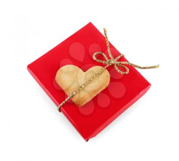 Gift box and cookie-heart on a white background. Isolated with clipping path. Top view.