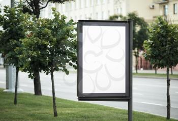 Blank street poster. Blank billboard on the city street. Isolated with clipping path. Shallow depth of field. Selective focus.