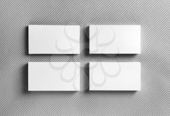 Photo of blank business cards on gray background. Template for ID. Mock-up for design presentations and portfolios. Top view.
