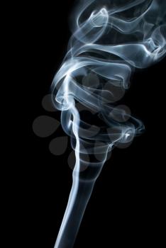 Abstract light smoke on black background. Vertical shot.