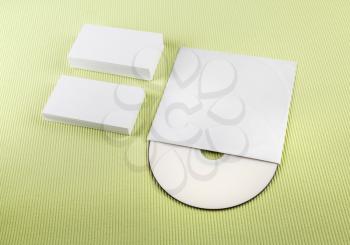 Business cards and CD on green background. Template for branding identity.
