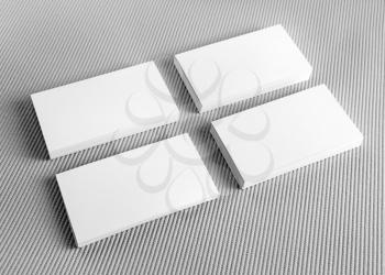Blank white business cards on gray background. Mockup for branding identity. Blank template for design presentations and portfolios. Template for ID.