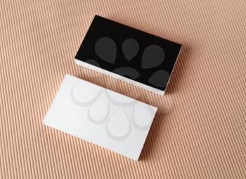 Black and white business cards on color background. Mock-up for branding identity. Top view.