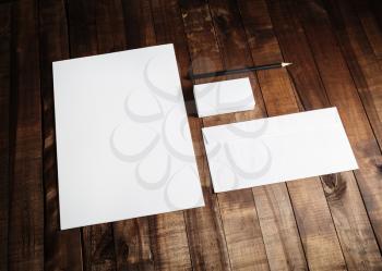 Mockup business template. Blank stationery set on wooden table background. ID template. Mock up for branding identity for designers. Blank letterhead, business cards, envelope and pencil.