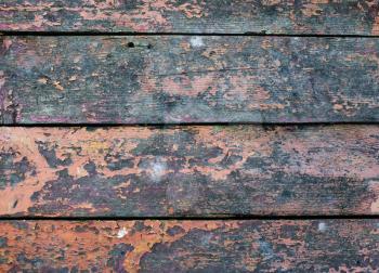 Old weathered wooden planks texture with peeling paint. Vintage wood background.