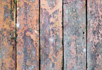 Old weathered wooden boards with peeling paint. Rustic wood background.