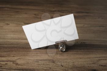 Blank business card. Photo of blank business card on vintage wood table background. Mockup for ID. Blank template for branding identity.