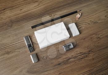 Bank business cards, pencil, eraser, flash drive and sharpener on wooden table background. Identity template. Mock up for placing your design. Top view.