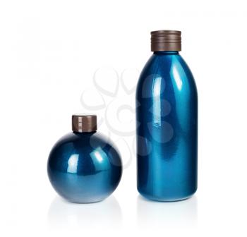 Two blank blue cosmetic bottles on white background. Plastic bottle. Beauty product package. Isolated with clipping path.