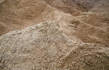 Closeup of sand. Coarse sand grains background. Selective focus.