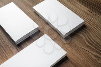 Blank business cards on wood background. Template for ID. Responsive design mockup.