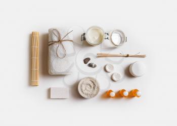 Spa and wellness cosmetic products on white paper background. Flat lay.