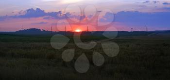 Scenic sunset in the countryside. Panoramic rural landscape. Panorama shot.