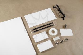Blank corporate stationery set on craft paper background. Branding mock up.