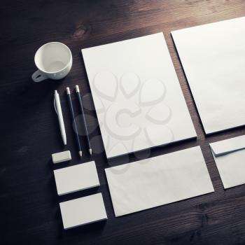 Blank corporate identity template on wooden background. Photo of blank stationery set. Mockup for design presentations and portfolios.