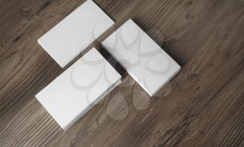 Photo of blank business cards on wooden background. Template for ID. Top view.