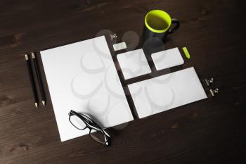 Photo of blank stationery set on wooden background. Corporate identity template. Responsive design mockup.