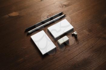 Branding stationery set. Blank business cards, pencil and eraser on wooden background. ID mockup. Responsive design template.